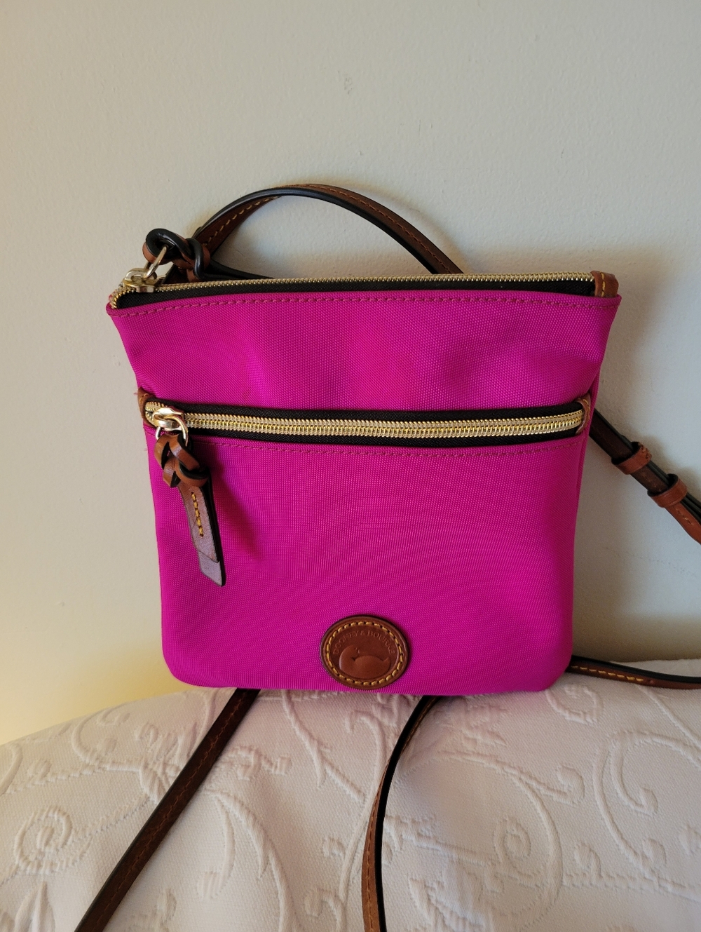 Dooney & Bourke Fuchsia Crossbody with Brown Leather Trim.